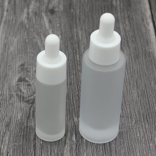 Classic 15ml and 30ml frosted glass dropper bottles for essential oil with white caps.