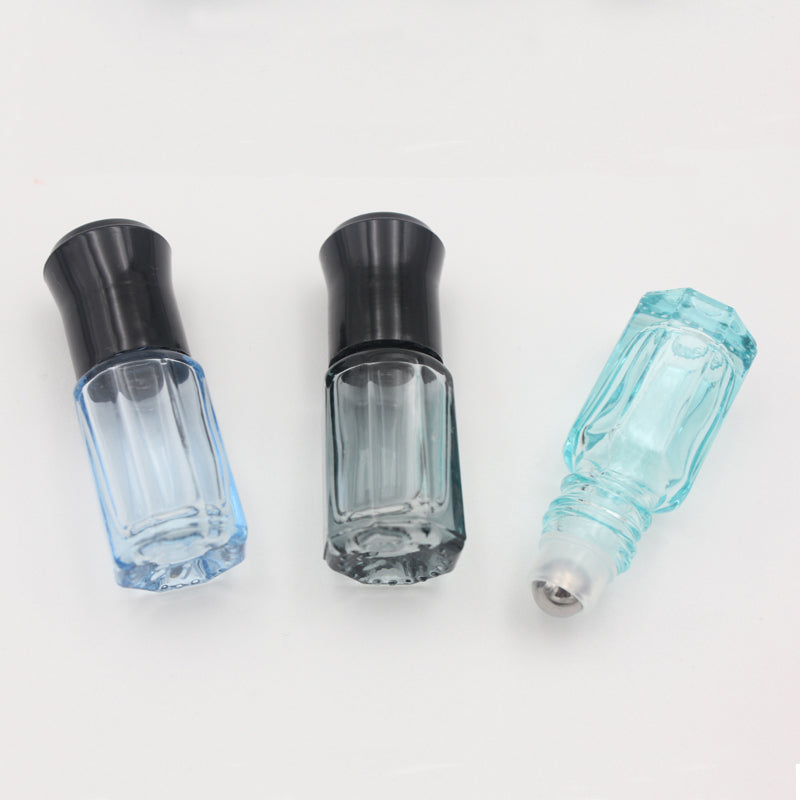 Colorful 3ml and 6ml glass essential oil roller bottles with stainless steel ball, three designs displayed.