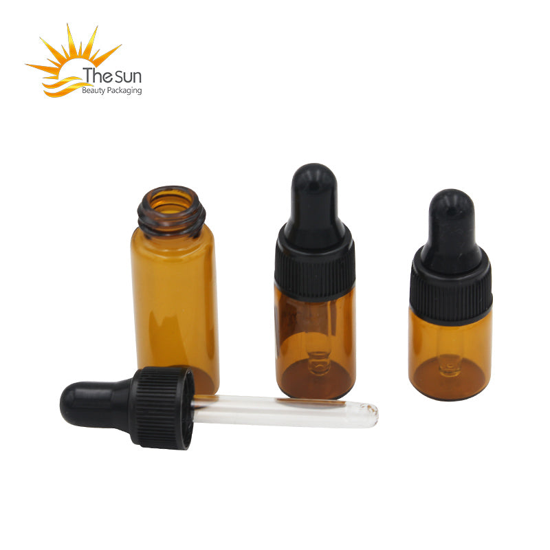 Mini amber glass dropper bottles in 2ml, 3ml, and 5ml sizes for essential oils and cosmetics.