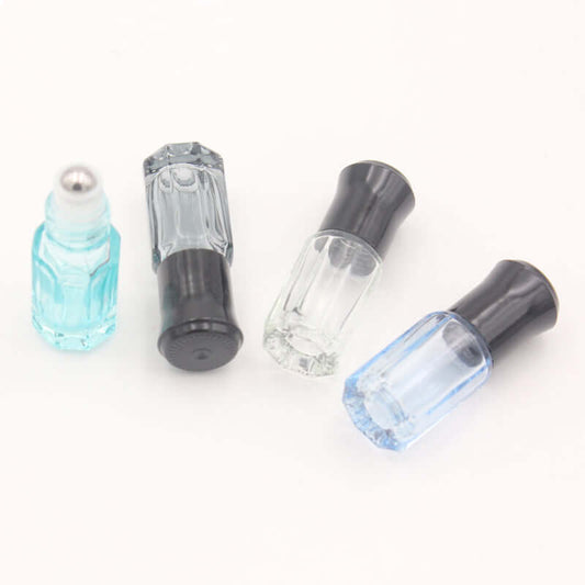 Colorful 3ml and 6ml glass essential oil roller bottles with stainless steel rolls, ideal for aromatherapy.