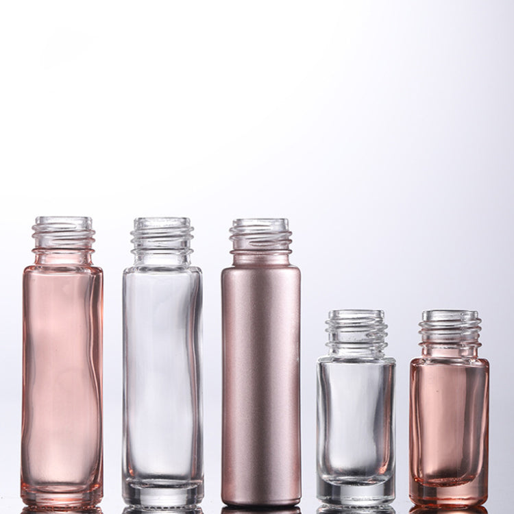 5ml and 10ml glass roll-on perfume bottles in rose gold and clear, perfect for essential oils and fragrances.
